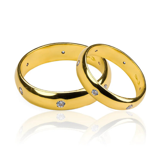 Argollas de matrimonio amor de rosas, fabricadas en oro 18 quilates de Joyería Caracas, viene con certificado de calidad y garantía de por vida.