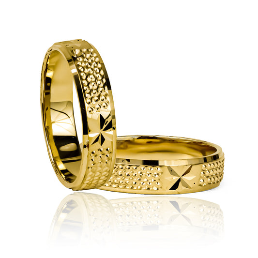 Argollas de matrimonio Starry Sky de Joyería Caracas, fabricadas en oro de 18K, cuentan con garantían de por vida.