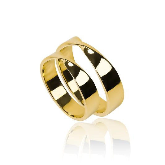 Argollas de matrimonio Torção. Fabricadas en oro de 18K por Joyería Caracas. Cuenta con certificado de calidad y garantía de por vida.
