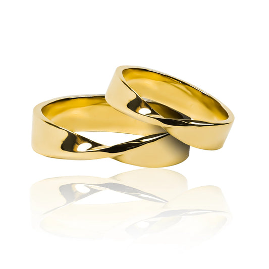Argollas de matrimonio Torção. Fabricadas en oro de 18K por Joyería Caracas. Cuenta con certificado de calidad y garantía de por vida.