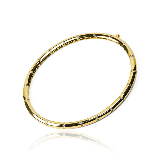 Pulsera Brazalete lunares cristal, elaborada en oro 18K por Joyería Caracas. Cuenta con su garantía de por vida.