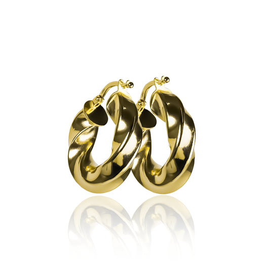 Candongas melcocha melcocha Spira S. Fabricada en Joyería Caracas, elaboradas en oro de 18K y cuenta con una garantía para toda la vida.