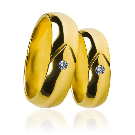 Argollas de matrimonio Crystal Arrow, fabricadas en oro 18k por Joyería Caracas, cada par de argollas cuenta con un certificado de calidad y garantía de por vida.