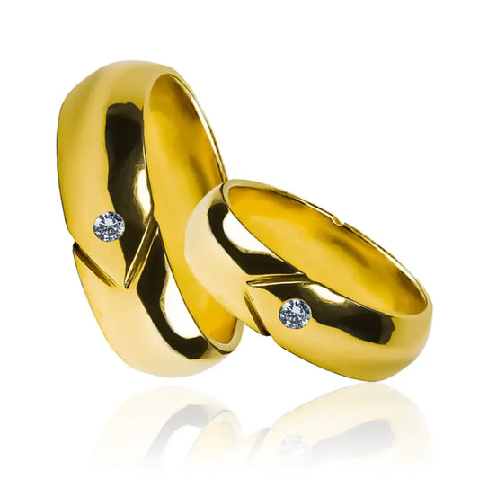 Argollas de matrimonio Crystal Arrow, fabricadas en oro 18k por Joyería Caracas, cada par de argollas cuenta con un certificado de calidad y garantía de por vida.