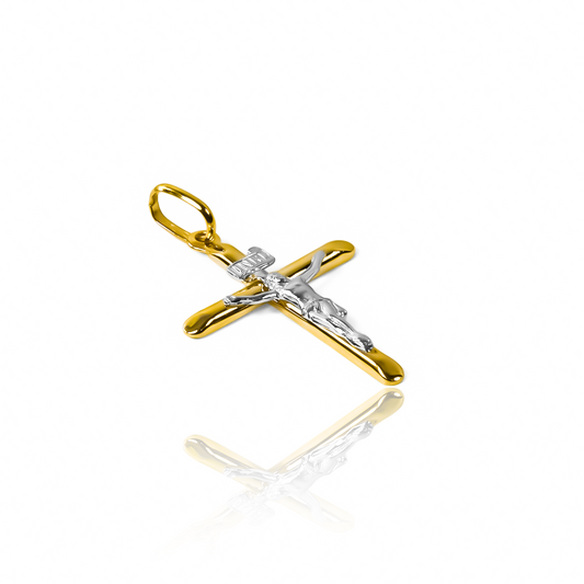 Dije Cruz cristo S medio tubo bicolor I. Hecho de Oro 18K por Joyería Caracas, cuenta con garantía de por vida.