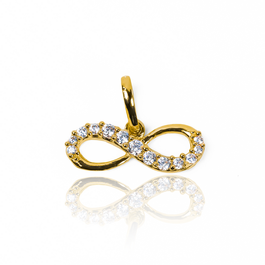 Dije Infinity Cristales JT. Hecho de oro 18K y con la garantía de Joyería Caracas para toda la vida.