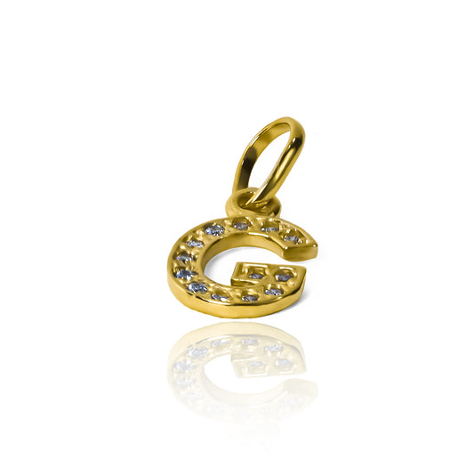 Dije Letra G crystal JT. Fabricado en oro 18K por Joyería Caracas, cuenta con garantía de por vida.