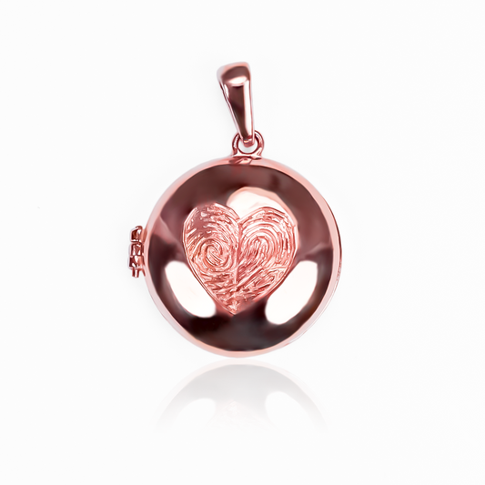 Dije Relicario huellas personalizadas. Hecho de Oro 18K por los expertos en Joyería Caracas, cuenta con garantía de por vida.