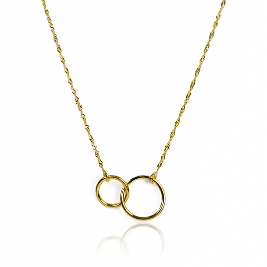 Gargantilla Aros Sin Fin, elaborado en oro 18K por Joyería Caracas, cuenta con un certificado de calidad y garantía de por vida.