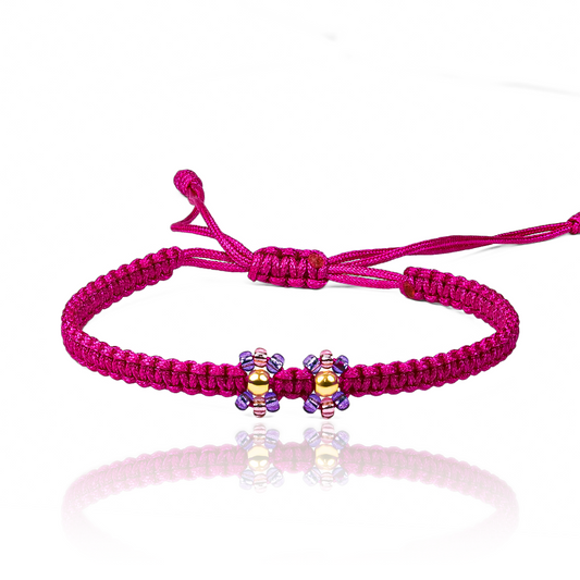 Pulsera Flor Esfera Lisa #3 x2 de Joyería Caracas está elaborada en oro 18k, con detalles en hilo coreano y bisutería de calidad. Con garantía de por vida y sin costo adicional.