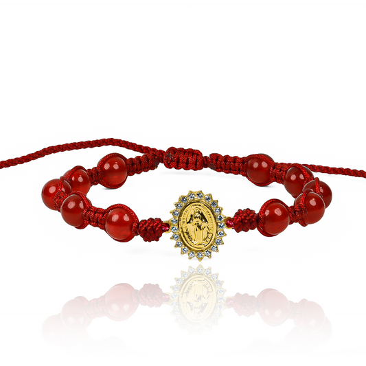 Pulsera Milagrosa L Cristales JT de Joyería Caracas está hecha en oro 18k, con detalles en hilo coreano y terlenca, además de bisutería de calidad. Con garantía de por vida y sin costo adicional.