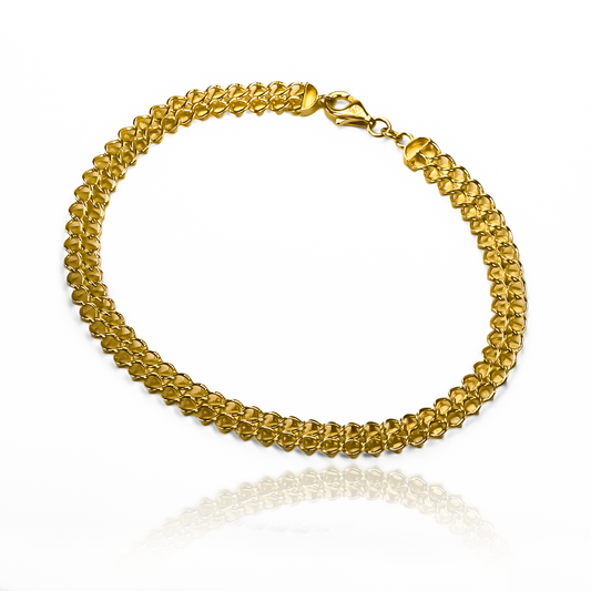 Pulsera doble faz hojas I elaborada en oro 18k por Joyería Caracas, cuenta con garantía para toda la vida.