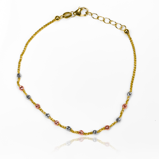 Pulsera esferas diamantadas 3 oros I fabricada en oro 18K por Joyería Caracas, cuenta con un certificado de calidad y garantía para toda la vida.