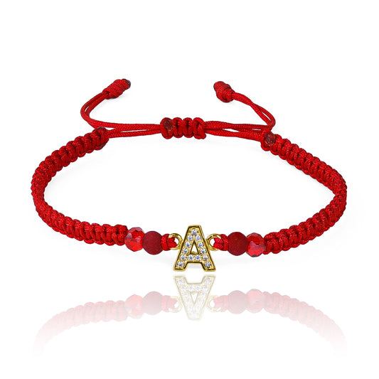 Pulsera Letra Cristales de Joyería Caracas está hecha en oro 18k, con hilo coreano y bisutería de calidad. Con garantía de por vida.