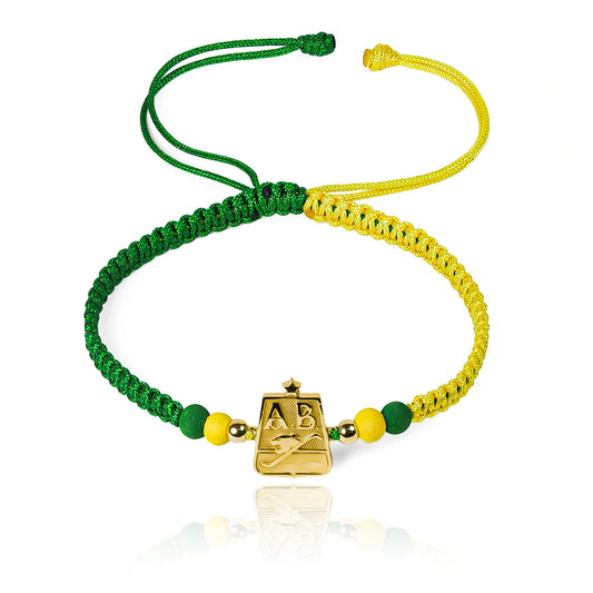 Pulsera Atlético AB Campeón de Joyería Caracas está elaborada en oro 18k, con detalles en hilo coreano y bisutería de calidad. Cuenta con garantía de por vida.