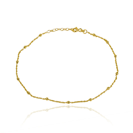 Tobillera mini esferas elaborada en oro 18K por Joyería Caracas, cuenta con garantía de por vida.