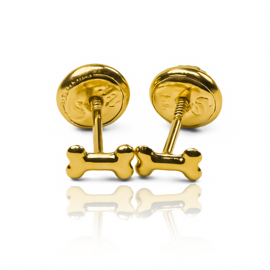 Topitos Huesitos mini de Joyería Caracas están hechos de Oro 18K, garantizando una calidad y durabilidad excepcionales.