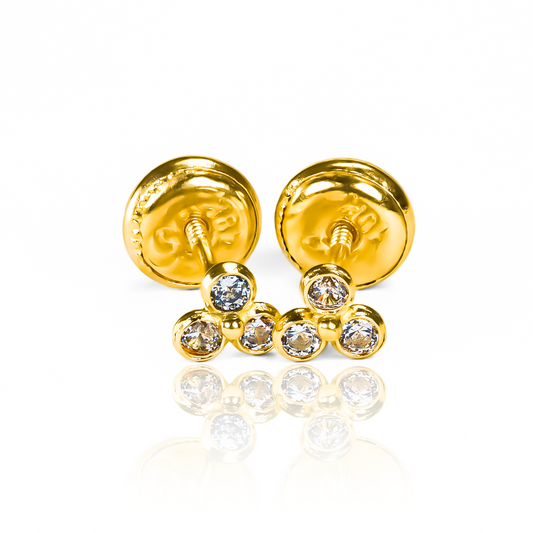 Topitos Mini flor de loto cristales fabricados en oro de 18 quilates por Joyería Caracas y cuentan con garantía de por vida.