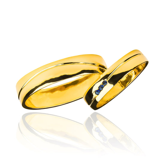 Argollas de matrimonio Atlantis Zafiro, fabricadas en oro 18k de Joyería Caracas, cuentan con un certificado de calidad y garantía para toda la vida.