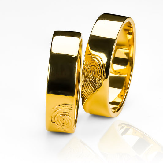Argollas de matrimonio Fingerprint Heart en oro 18k por Joyería Caracas, cuenta con certificado de autenticidad y garantía de por vida.