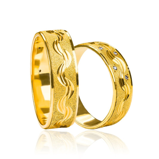 Argollas de matrimonio Ondas de Cristal, elaboradas en oro 18k por Joyería Caracas. Cada argolla cuenta con un certificado de calidad y garantía para toda la vida.