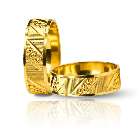 Argollas de matrimonio Pasión, elaboradas en oro 18k por Joyería Caracas, cuenta con certificado de calidad y garantía de por vida.