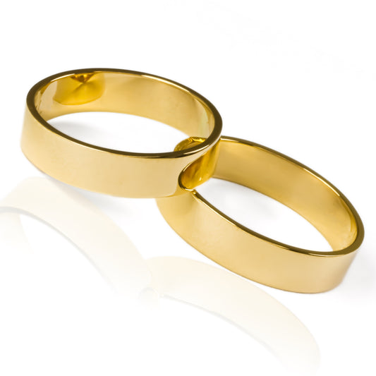 Argollas de matrimonio plane elegance, fabricadas en oro de 18k de Joyería Caracas, viene con certificado de calidad y garantía para toda la vida.