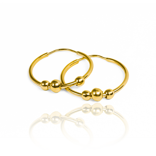 Eleva tu estilo con los aretes Sin fin XL + esferas - wJC. Confeccionados en oro 18K por Joyería Caracas, estos aretes son la perfecta expresión de elegancia y sofisticación. Con garantía para toda la vida, son una inversión que durará por siempre.