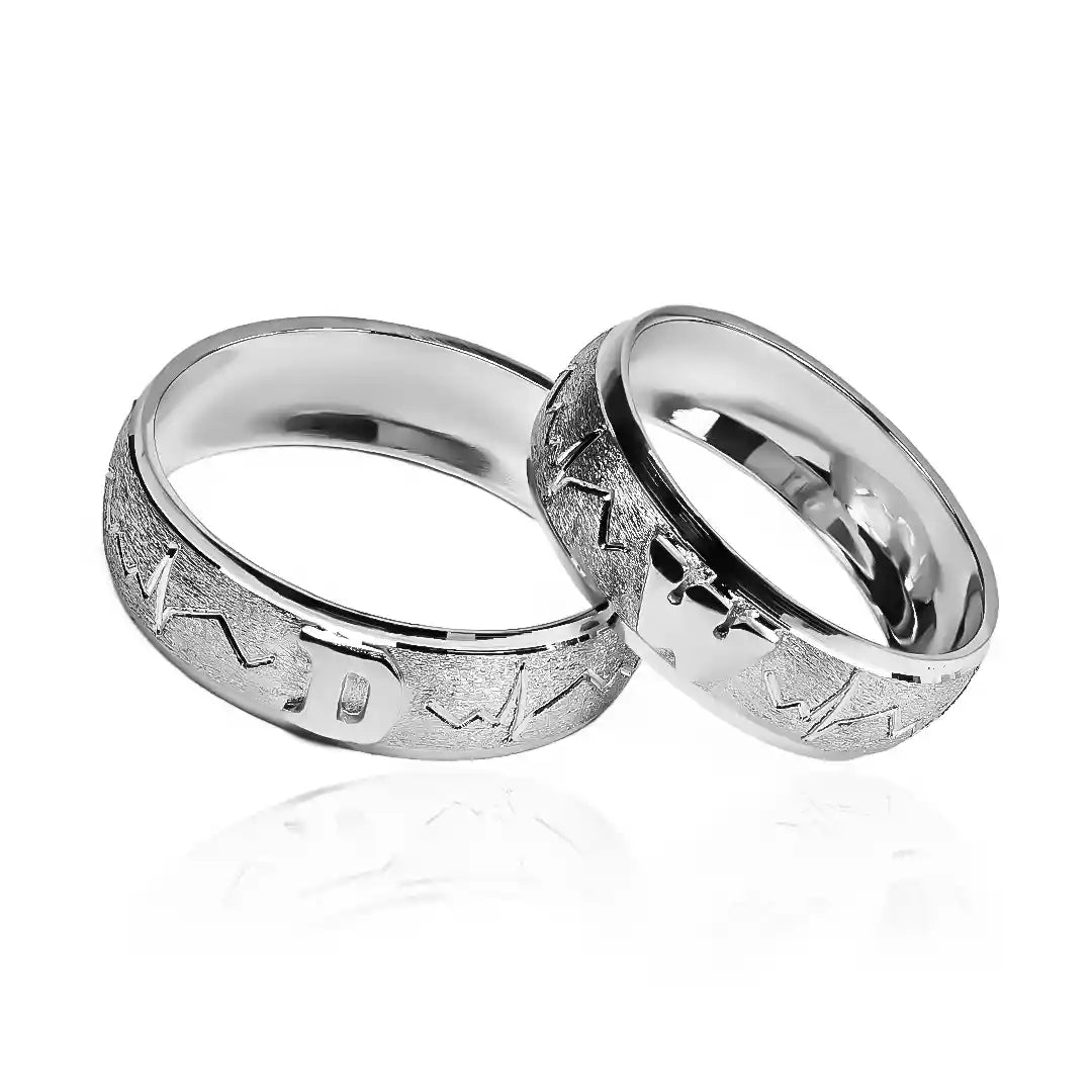 Argollas de matrimonio latidos iniciales corazones Joyeria Caracas