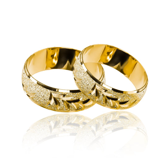 Argollas de matrimonio Twigs. Fabricadas en oro de 18K por Joyería Caracas. Cuenta con garantía de por vida.