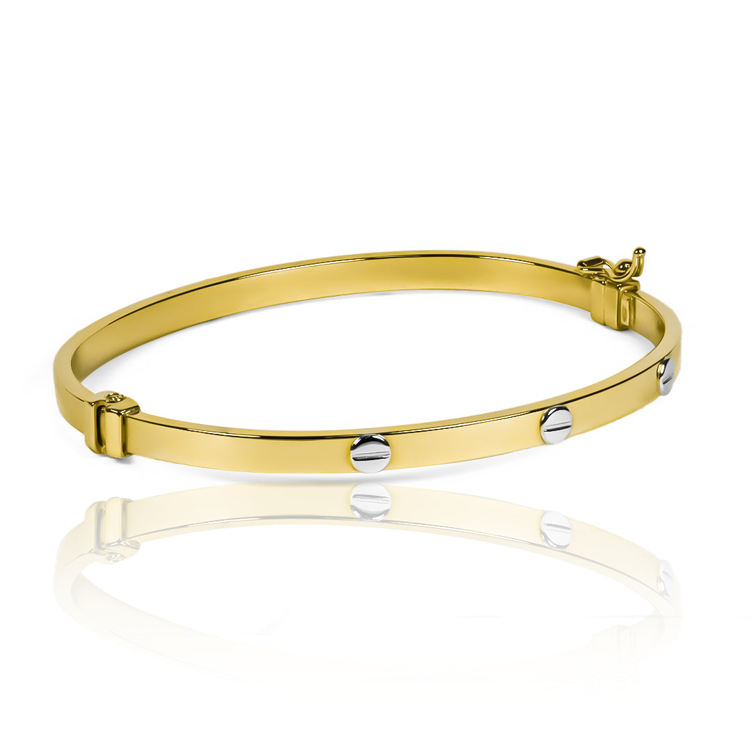 Pulsera Aro tornillos es una elegante pieza fabricada en oro 18K por Joyería Caracas. Cuenta con garantía de por vida.