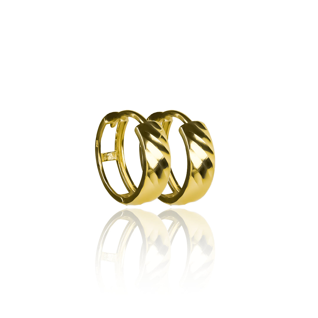 Candongas diamantadas ímpetu, elaboradas en oro de 18K por Joyería Caracas. Con garantía para toda la vida.