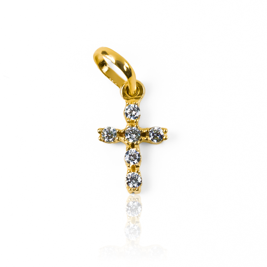 Dije Cruz S con cristales JT está elaborado con oro 18K de la reconocida Joyería Caracas. Con su elegante diseño y su garantía para toda la vida.