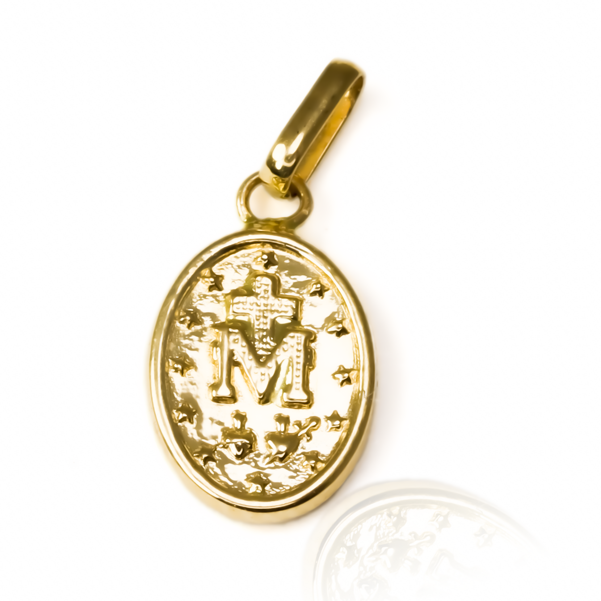 Dije Milagrosa JT M es un accesorio de joyería exclusivo de Oro 18K de Joyería Caracas. Con una garantía para toda la vida.