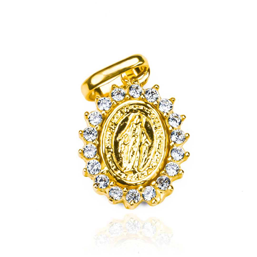 Dije Milagrosa crystal S JT, una pieza única de oro 18K de Joyería Caracas, cuenta con garantía de por vida. 