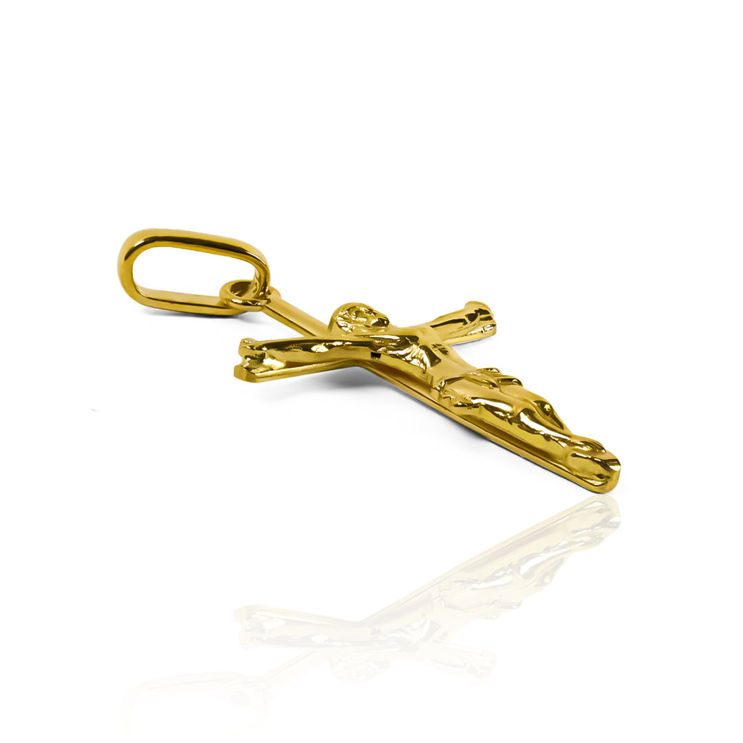Dije Cruz Cristo L JC, fabricado en oro 18K por Joyería Caracas. Con una garantía para toda la vida.