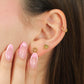 Oreja de mujer con topito en forma de barbie en oro amarillo de 18 quilates, hechos en Joyería Caracas. 