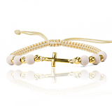 Pulsera Cruz L + Esferas #4 x 8 Facetadas de Joyería Caracas está hecha en oro 18k, con hilo coreano y bisutería de calidad. Con garantía de por vida y sin costo adicional.