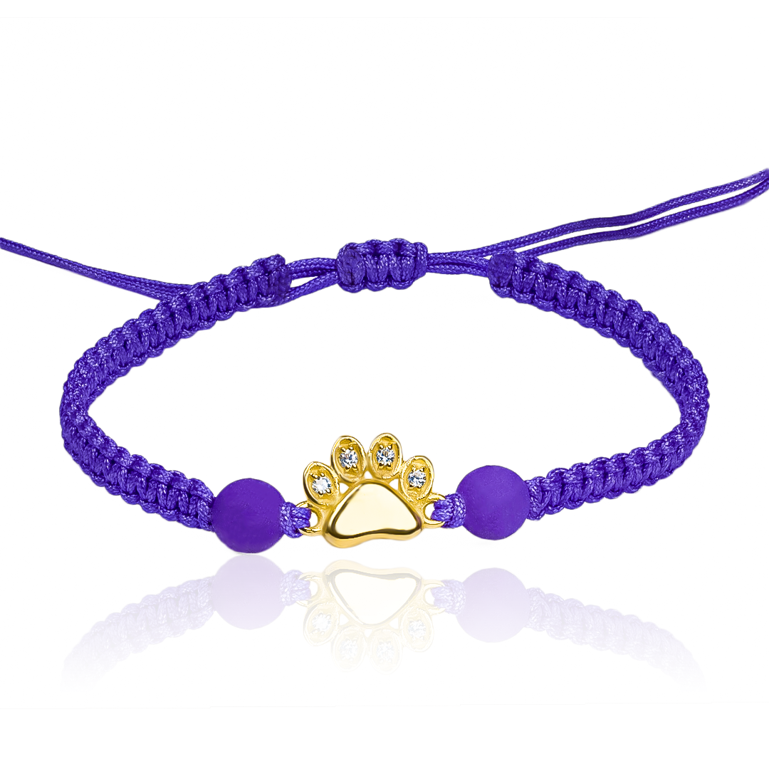 Pulsera Huellita de Joyería Caracas está elaborada en oro 18k, con detalles en hilo coreano y bisutería de calidad. Con garantía de por vida y sin costo adicional.