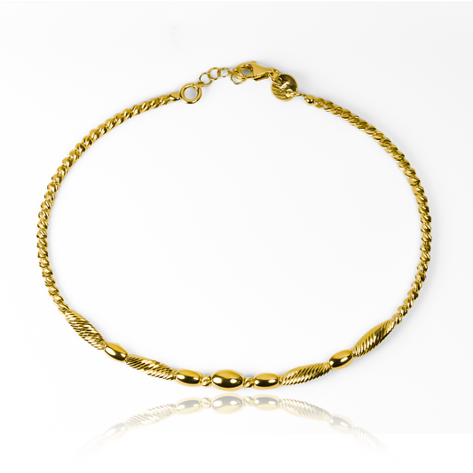 Esta pulsera guaya capullo I, de oro 18K, es una joya exclusiva de la prestigiosa Joyería Caracas. Con garantía para toda la vida, esta pulsera es el símbolo perfecto de elegancia y distinción. Cada vez que la lleves puesta, sentirás la calidad y el lujo de los mejores materiales y diseño.