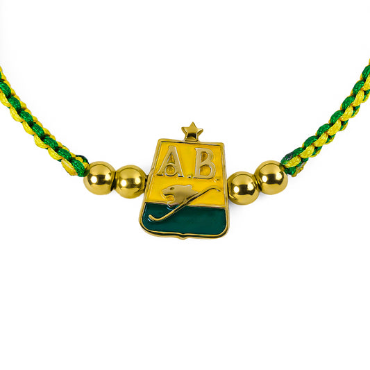 Pulsera Atlético AB Campeón elaborada por Joyería Caracas en oro 18k, con detalles en hilo coreano y bisutería de calidad, cuenta con garantía de por vida.