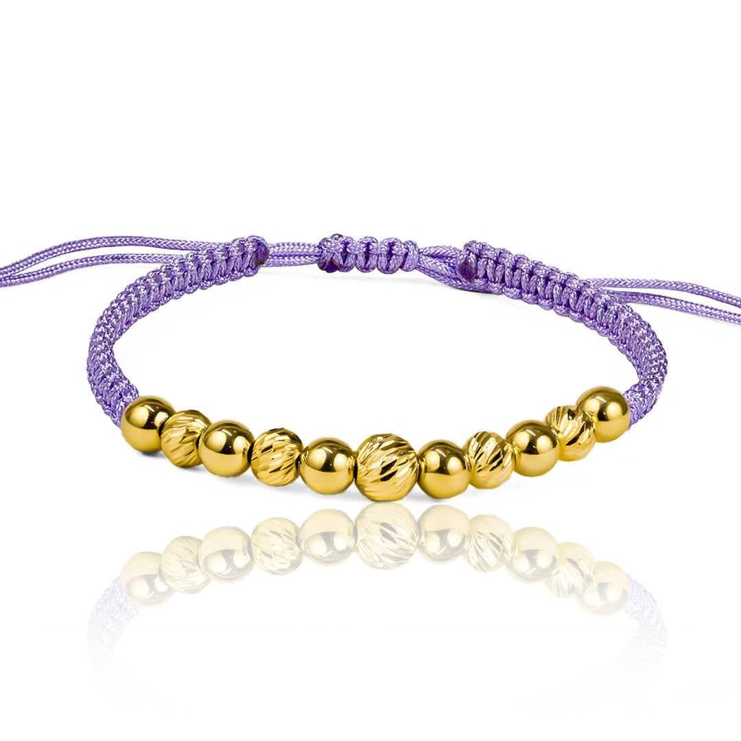 Pulsera Esferas Facetadas y Lisas de Joyería Caracas está hecha en oro 18k y cuenta con detalles en hilo coreano y bisutería de calidad. Con garantía de por vida.