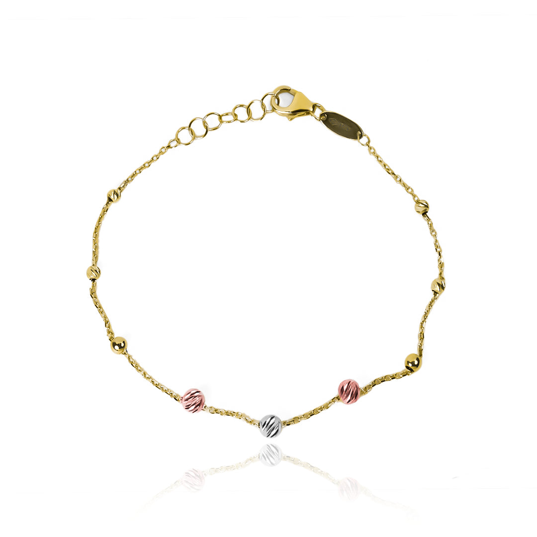 Pulsera faceted spheres 3 oros de Joyería Caracas. Confeccionada en oro 18K, esta pieza cuenta con un certificado de calidad y garantía de por vida.