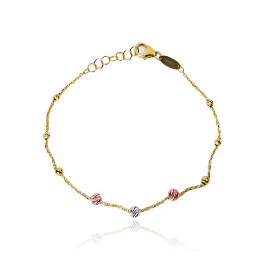 Pulsera faceted spheres 3 oros de Joyería Caracas. Confeccionada en oro 18K, esta pieza cuenta con un certificado de calidad y garantía de por vida.