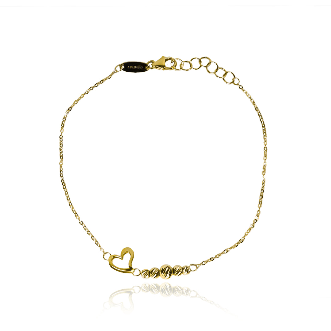 Pulsera spheres and heart. Fabricada en Oro 18K por Joyería Caracas, cuenta con garantía para toda la vida.