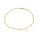 Adorne su tobillo con la elegante tobillera mini esferas de oro 18K de Joyería Caracas. Una pieza exclusiva con garantía de por vida que aportará un toque de lujo y sofisticación a su estilo. Una joya que lo acompañará siempre.