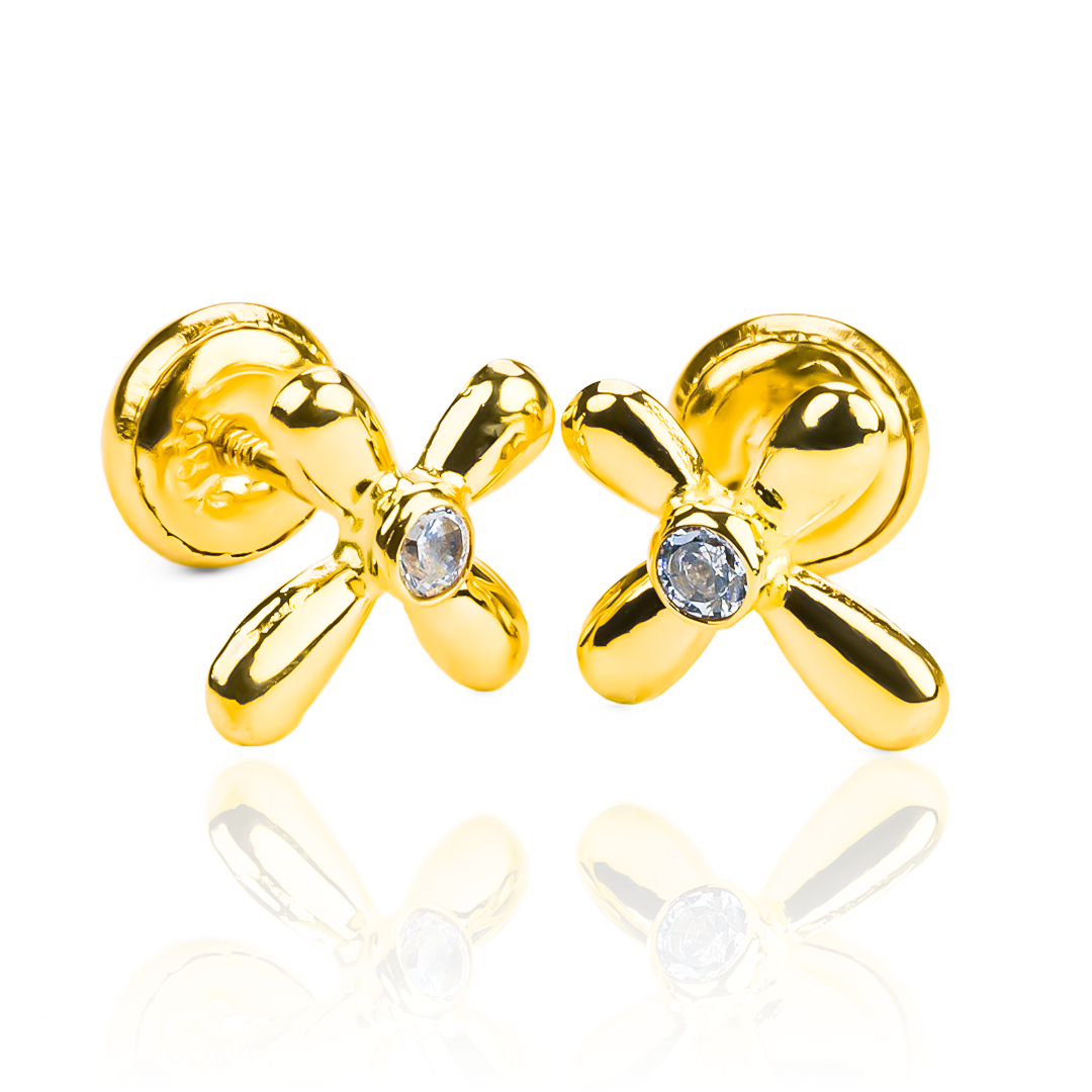 Topitos Cruz centro cristal es una pieza de joyería de lujo elaborada en oro 18K. Proviene de la exclusiva Joyería Caracas y cuenta con una garantía de por vida, asegurando su calidad y durabilidad.