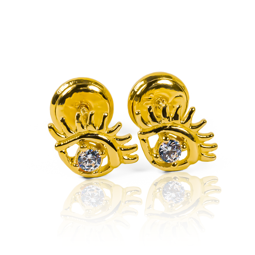Descubre la elegancia y protección de los Topitos Ojo turco cristal, con adornos de Oro 18K y la calidad de Joyería Caracas. Una pieza exclusiva con garantía de por vida para agregar un toque sofisticado a tu colección. Protege tu energía con estilo.