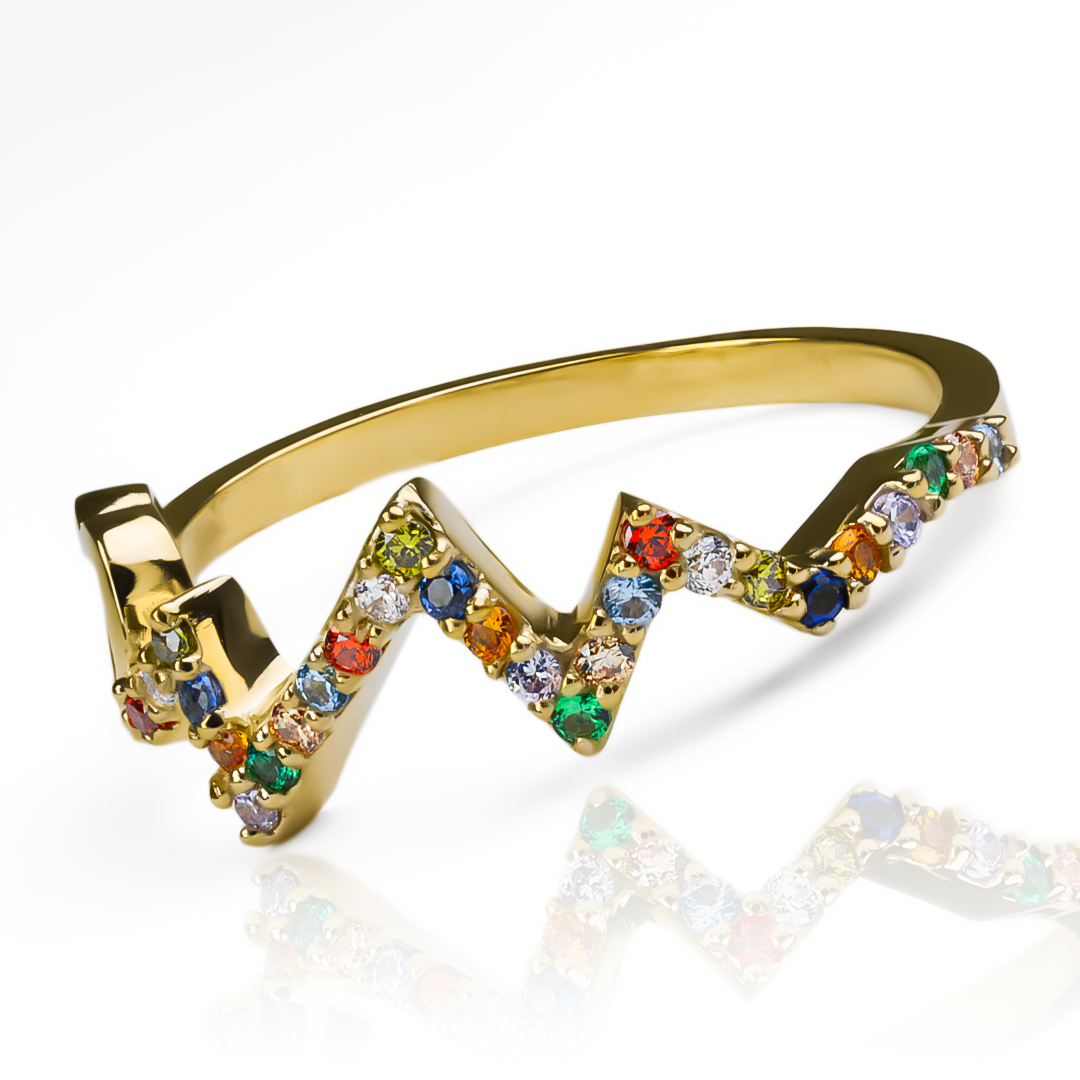Anillo multicolor heart beat te robará el corazón. Hecho con oro 18k, esta Joyería Caracas es el epitome de lujo y estilo. Con una garantía para toda la vida.