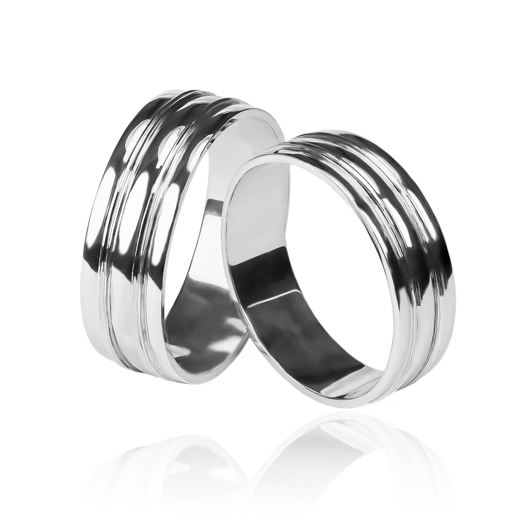 Argollas de matrimonio Concave Buríl, elaboradas en oro de 18k por Joyería Caracas, cada una cuenta con certificado de calidad y garantía de por vida.